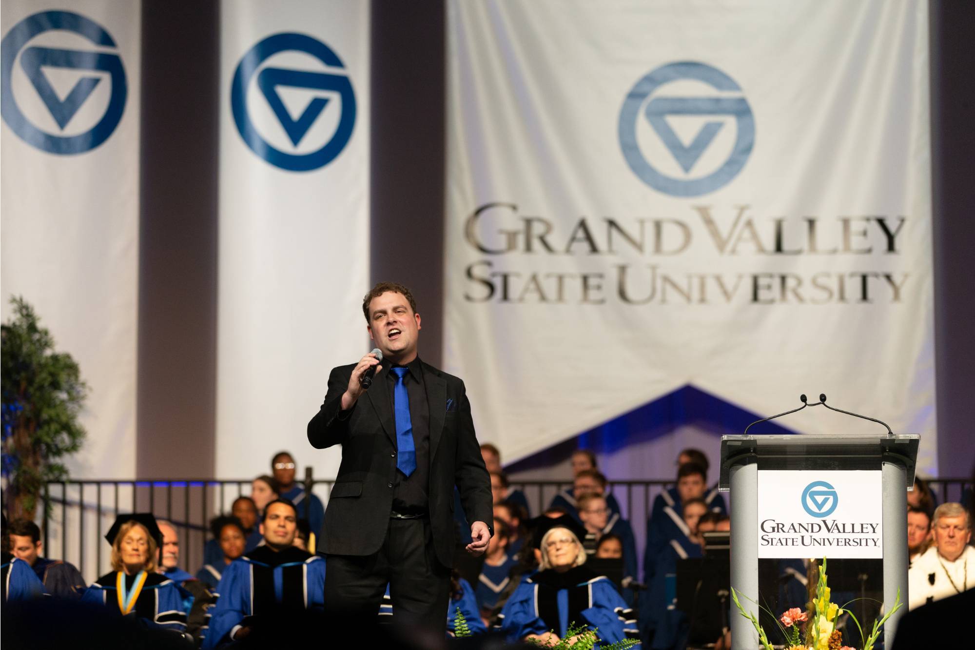 Performer speaking into microphone